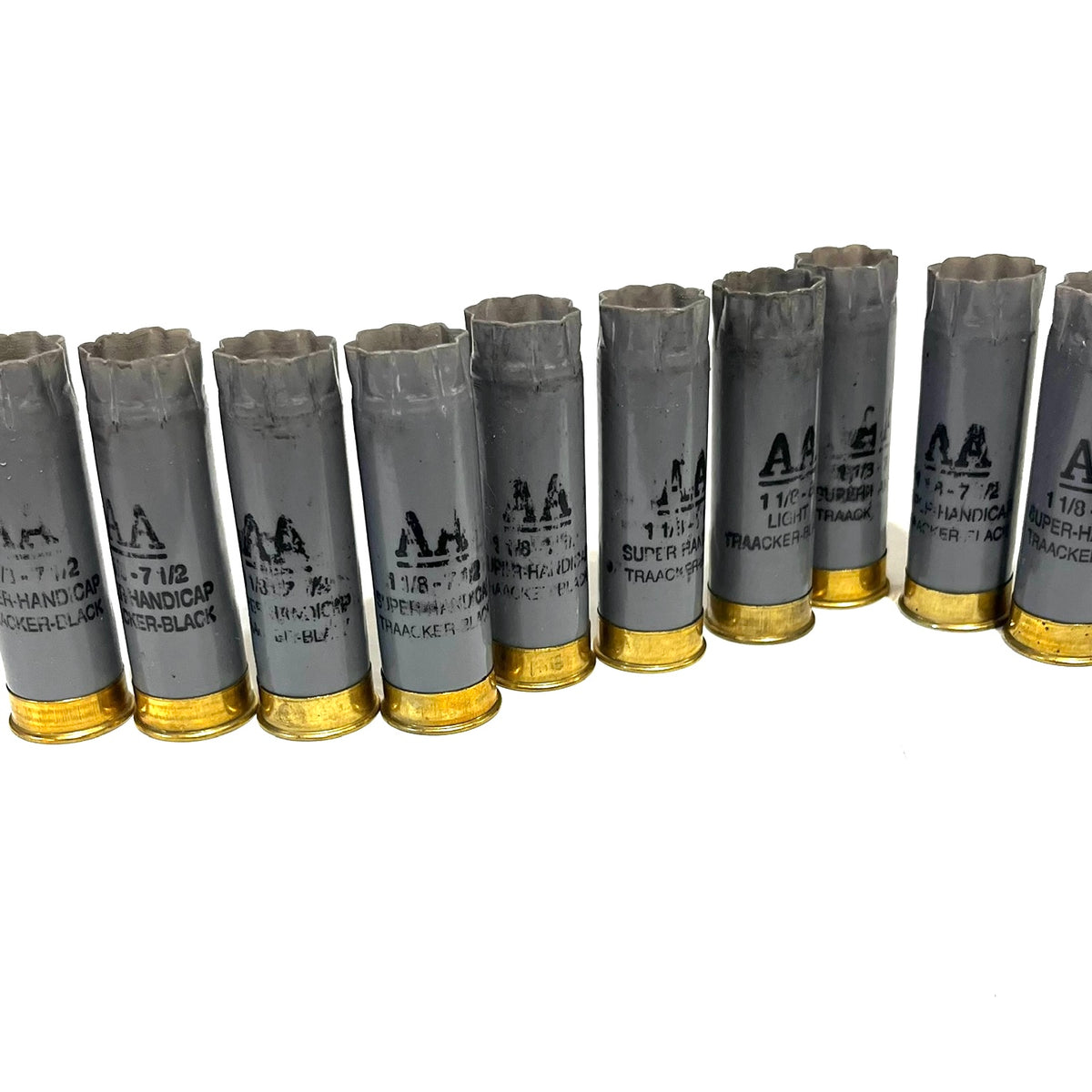 Row of light gray Winchester AA 12 gauge shotgun shells with gold bases viewed at an angle