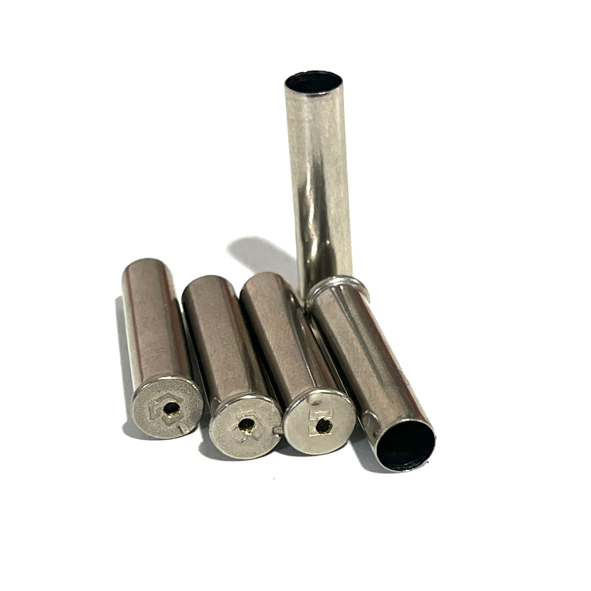 5 empty nickel .22 caliber once fired shells with drilled holes through the headstamp for bullet jewelry, arranged in a fan pattern on a white background