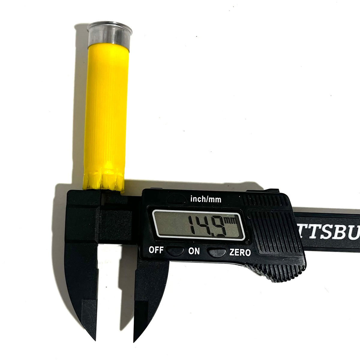 Digital caliper measuring the diameter of a yellow shotgun shell with silver base showing 14.9 mm