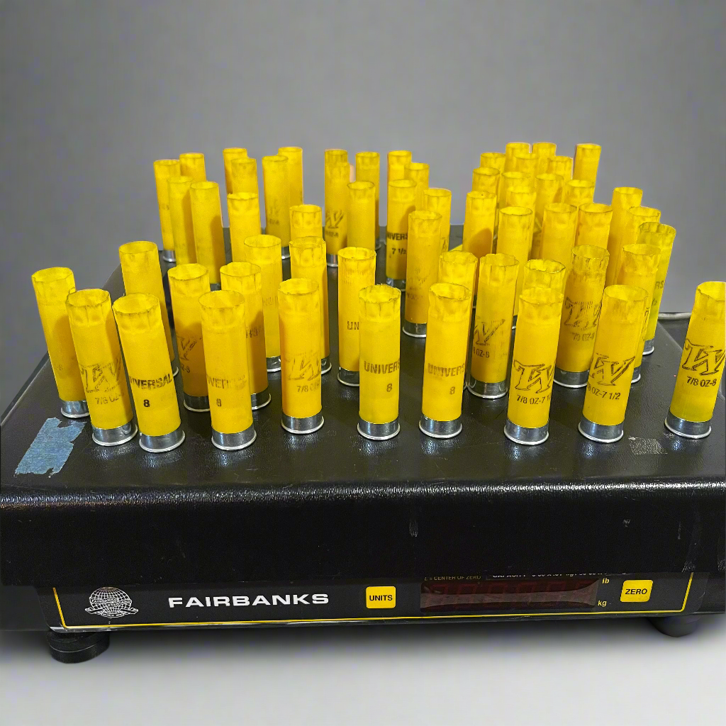 Rows of yellow shotgun shells standing on a Fairbanks digital scale