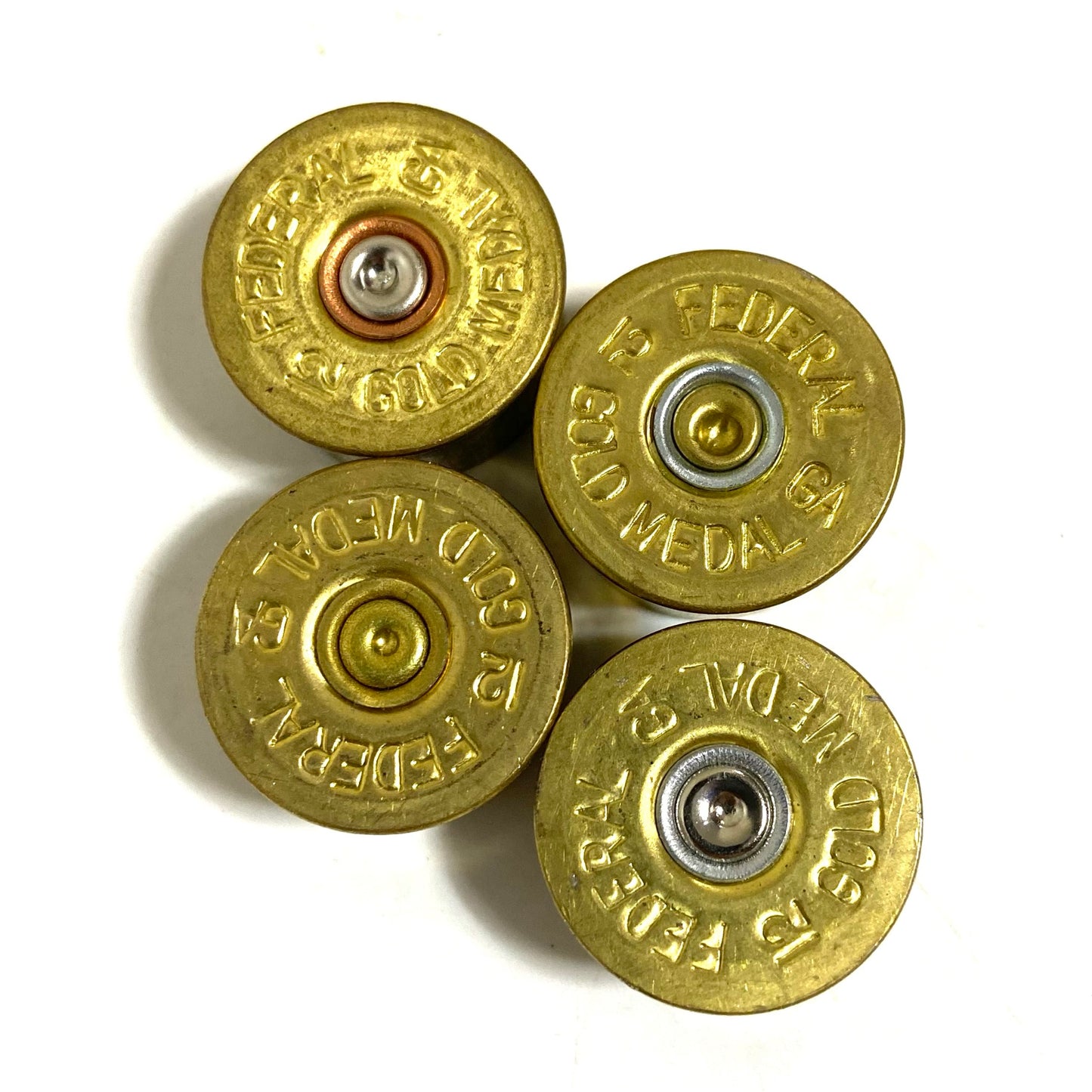 Gold-toned 12 gauge Federal headstamps used for crafting and jewelry making
