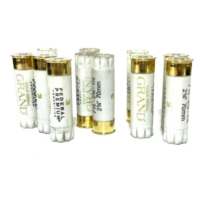 Five white 12 gauge hulls standing vertically next to each other against a white background.