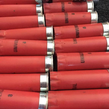 Red Winchester Universal 12 Gauge Hulls Lined Up In Diagonal Rows