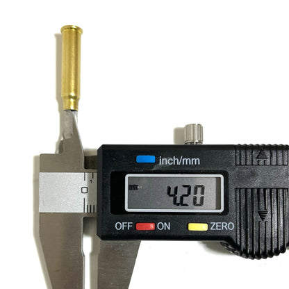 A digital caliper measuring the mouth diameter of a .17 HMR empty brass cartridge casing, showing a display of 4.20 mm on a white background.