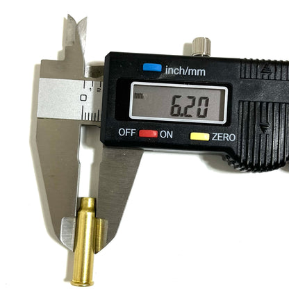 A digital caliper measuring the width of a .17 HMR empty brass cartridge casing, showing a display of 6.20 mm on a white background.