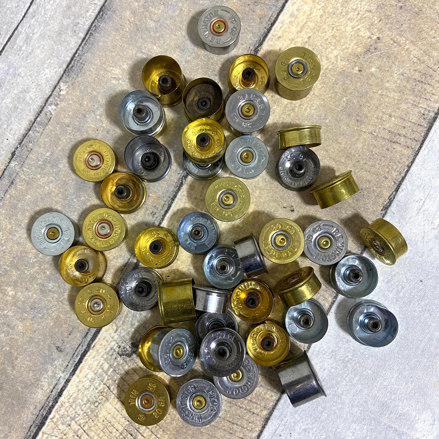 Overview of 40-piece batch of 20 gauge gold and silver headstamps.