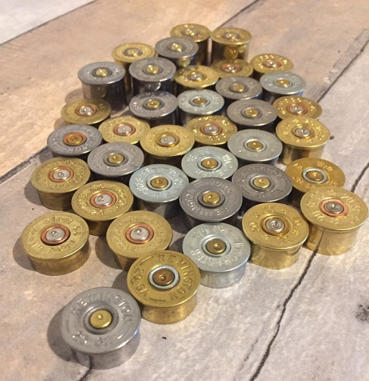 Inert 20 gauge spent metal hulls suitable for jewelry making.