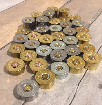Inert 20 gauge spent metal hulls suitable for jewelry making.