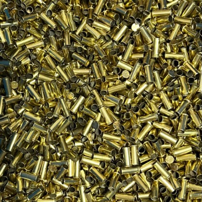 Large pile of raw uncleaned spent 22 caliber brass shell casings
