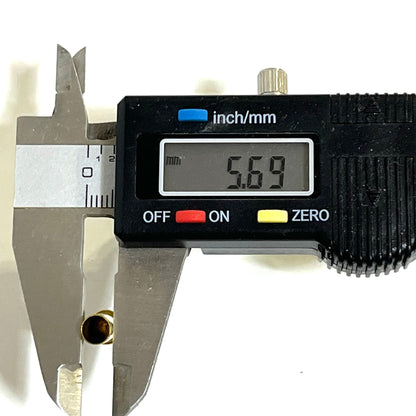Digital caliper measuring the head diameter of an inert .22LR brass casing at 5.69 mm