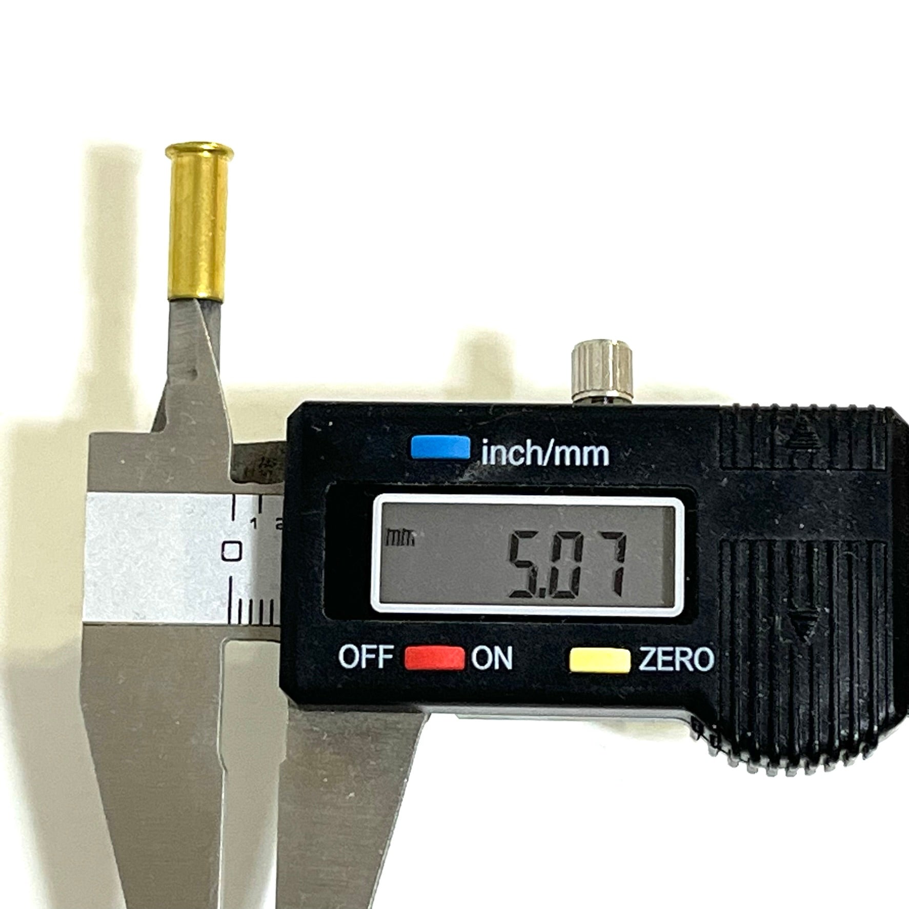 Digital caliper measuring the mouth diameter of a spent .22LR brass casing at 5.07 mm