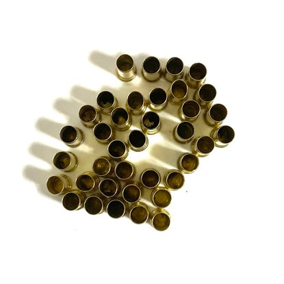 Grid array of spent .22LR brass casings viewed from above
