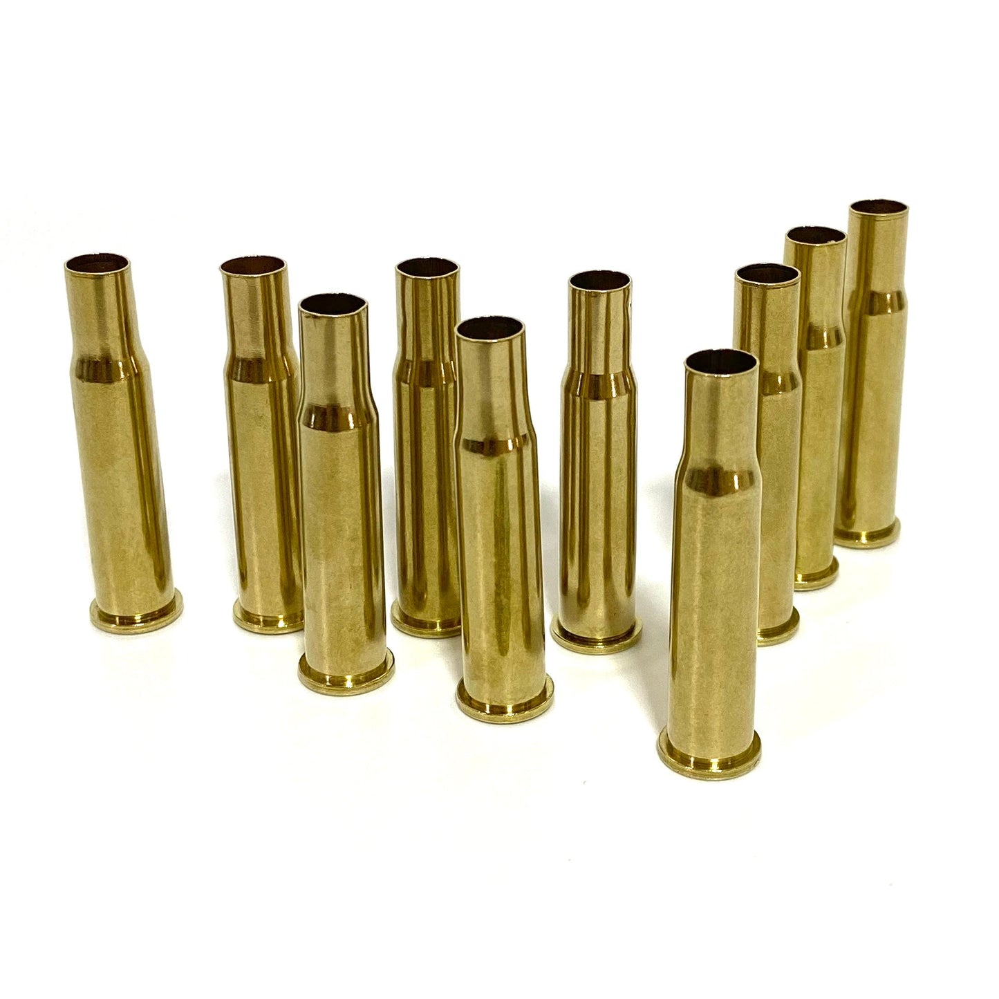 10 polished 30-30 Winchester brass casings standing upright, empty once-fired shells with a bright yellow-gold shine.
