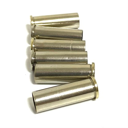 Five silver nickel casings from once-fired 38 Special cartridges, fanned together on a white background.