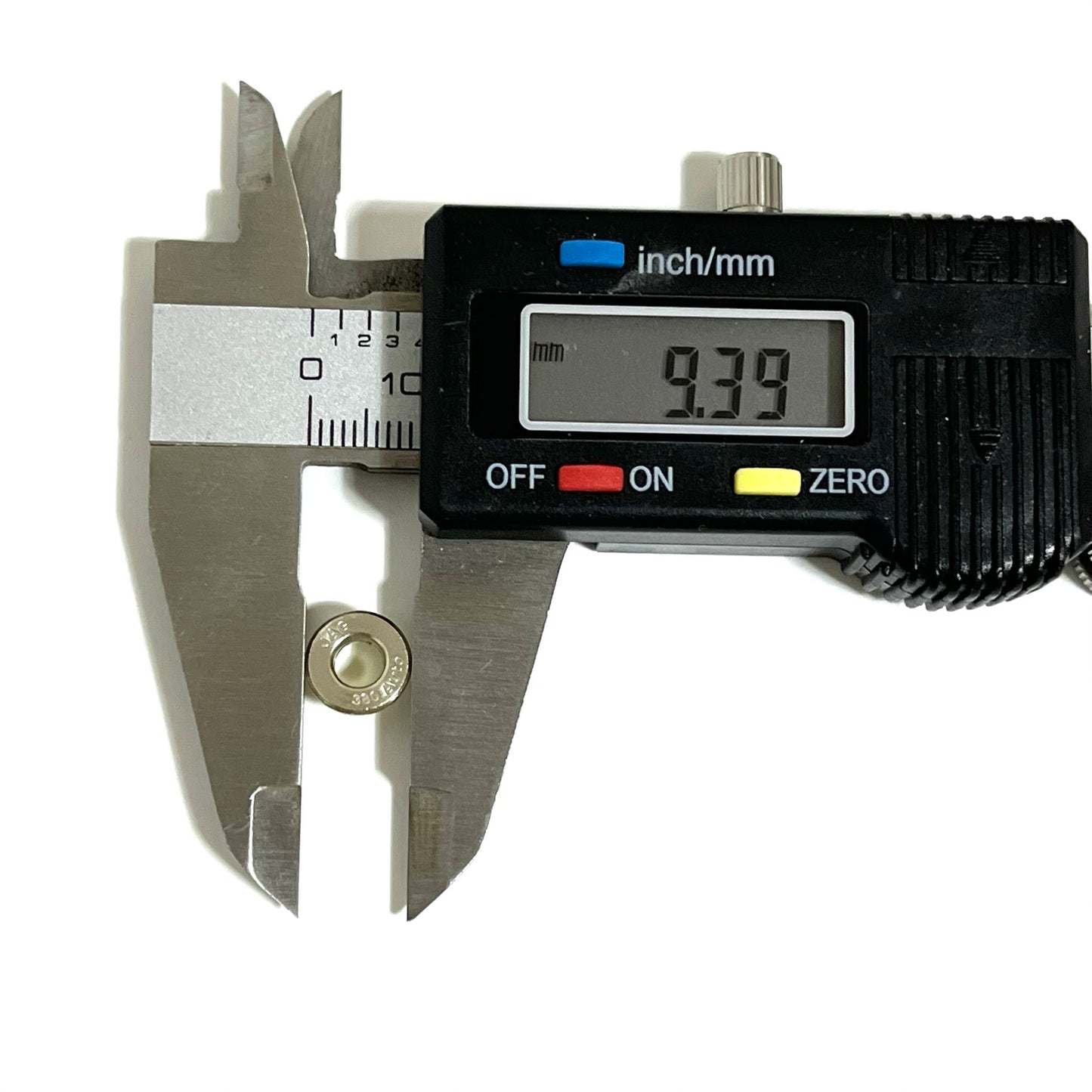 Single deprimed 380 Auto bullet slice measured across outer diameter with a digital caliper displaying 9.39 mm.
