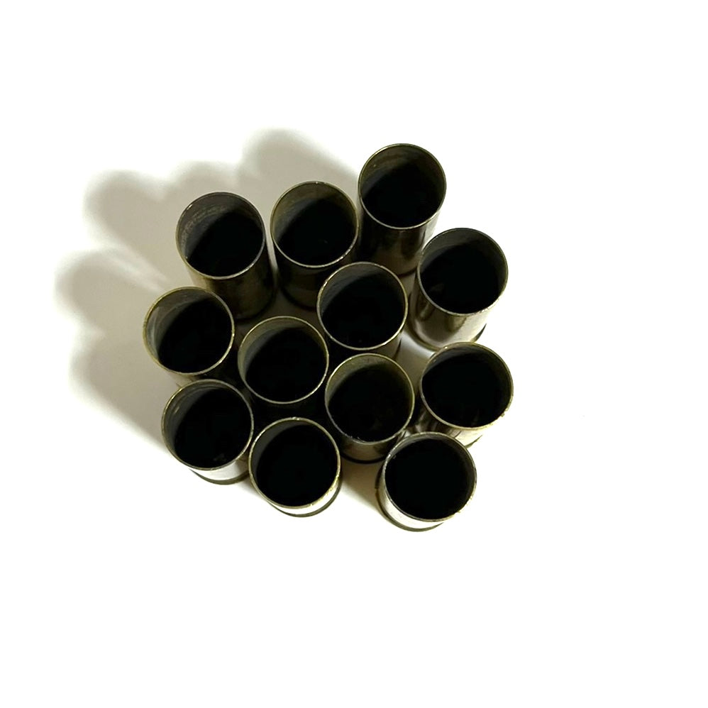Eleven gold .45 Colt brass casings viewed from above, showing open mouths