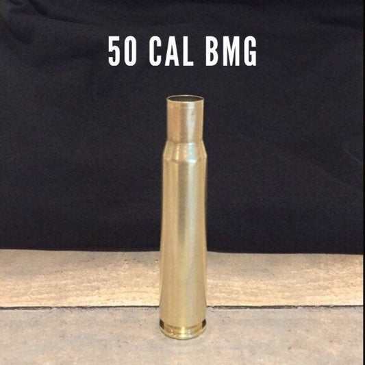 A single 50-bmg  brass casing stands upright, labeled '50 CAL BMG' against a dark background.