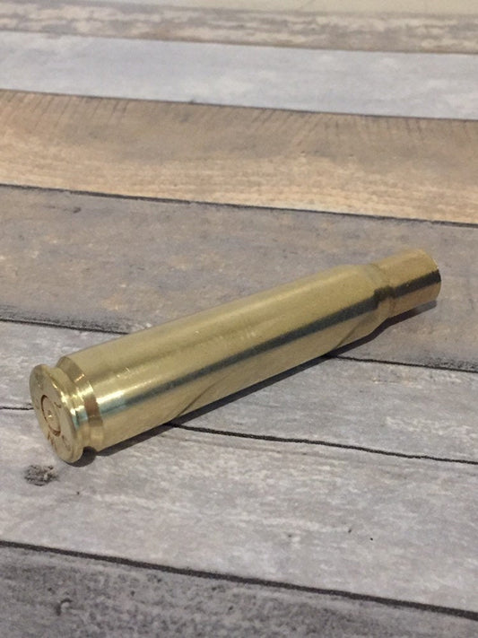 Genuine once-fired .50 BMG brass casing, hand-polished, headstamp dimpled spent primer.