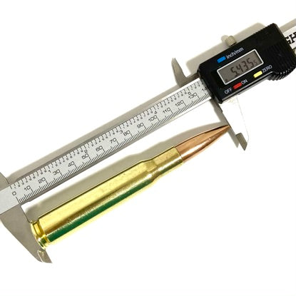 A 50 cal dummy paperweight length being measured with a digital caliper showing 5.435 inches on a white background.