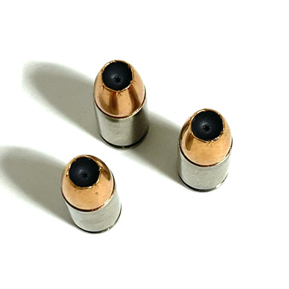 Digital caliper measuring the overall length of an inert 9MM Luger nickel dummy round at 28.39mm. Authentic once-fired brass casing with JHP bullet. Accurate scale reference for crafters and prop makers.