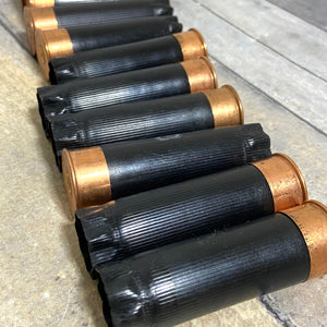 Black and Copper Colored Used Shotgun Shells
