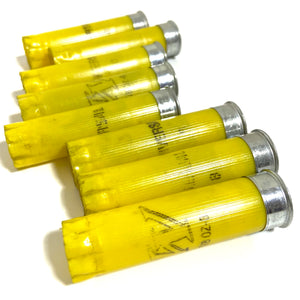 Yellow 20 Gauge Empty Shotgun Shells Once Fired