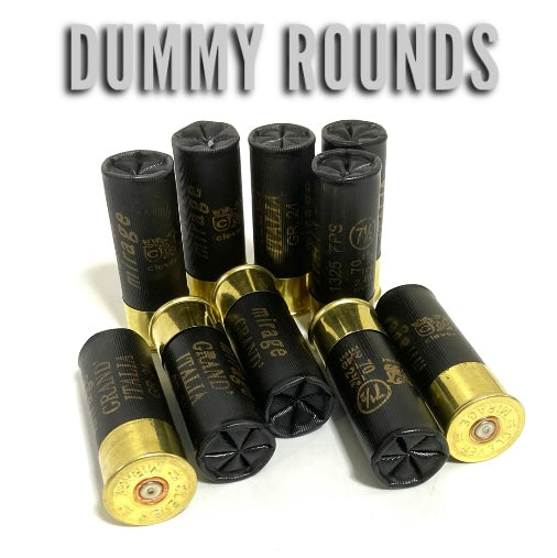Ten black 12 gauge dummy rounds with gold colored brass bottoms standing and lying on a white background, overlay: DUMMY ROUNDS