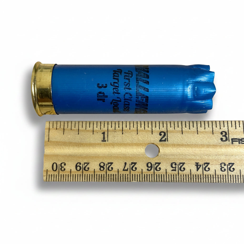 Blue Challenger 12 gauge shotgun shell shown next to a ruler for size reference