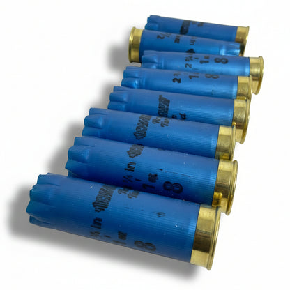 Row of star-crimped blue Challenger 12 gauge shotgun shell hulls