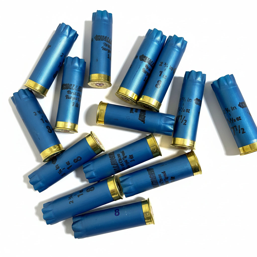Scattered pile of blue Challenger 12 gauge shotgun shell hulls with gold bases