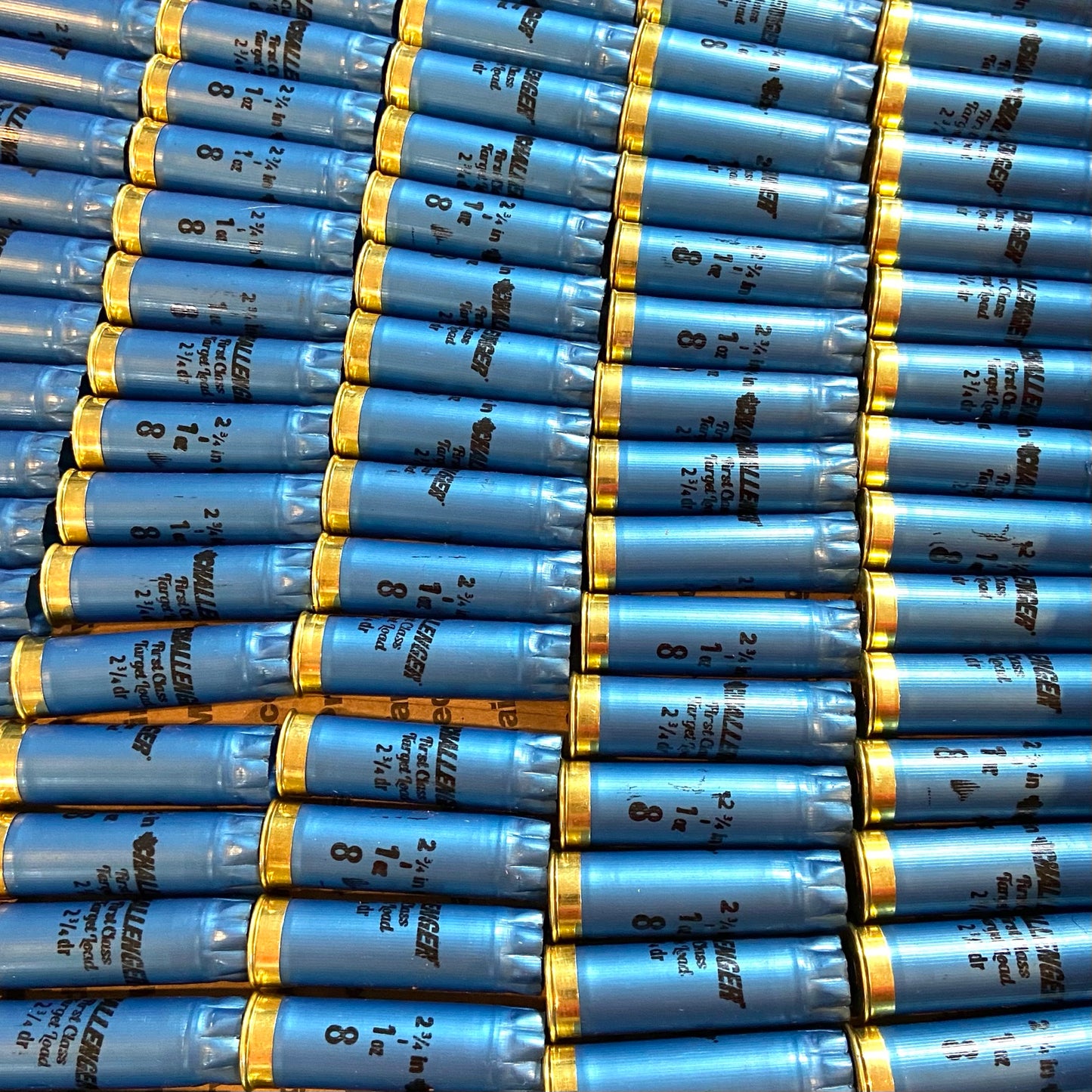 Bulk array of blue Challenger 12 gauge shotgun shell hulls