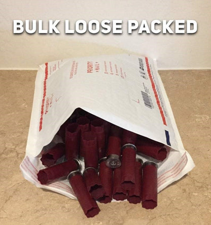 Dark red empty 12 gauge shotgun hulls spilling out of a Priority Mail envelope with BULK LOOSE PACKED text overlay.