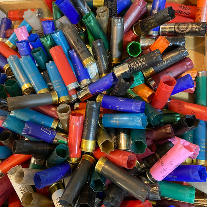 Top-down view of multi-colored 12ga shells. Inert 12ga shells for crafts (no powder/primers).
