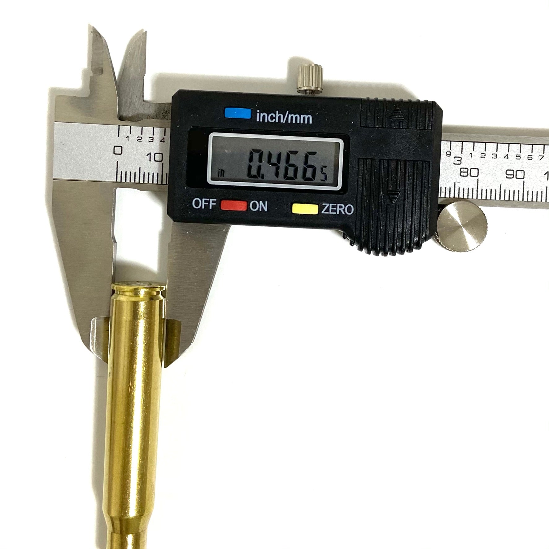 A digital caliper measuring the neck diameter of a single brass bullet casing, showing a digital readout of 0.466.
