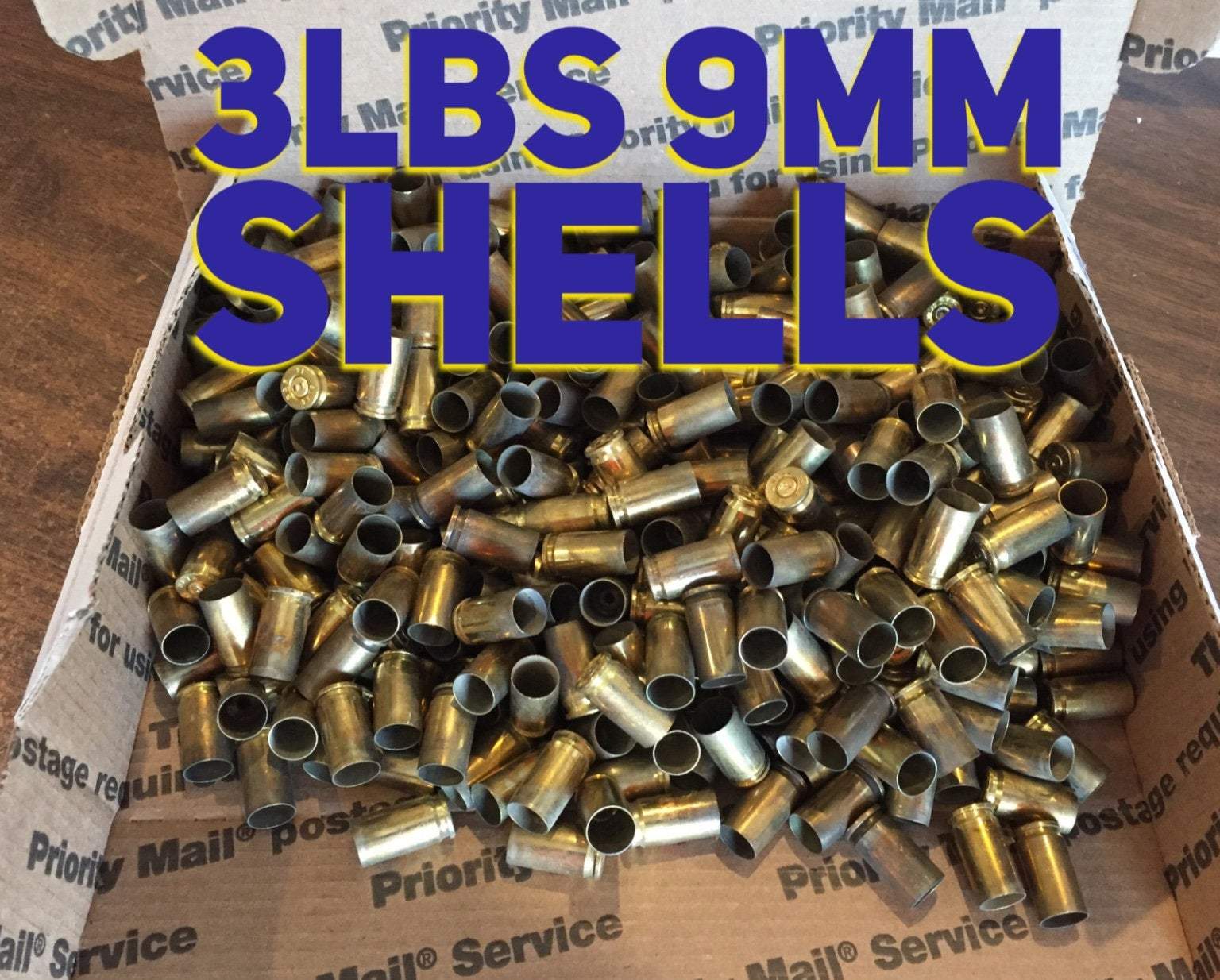 Pile of brass casings in a shipping box with bold 3LBS 9MM SHELLS text overlay