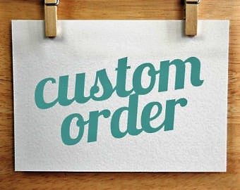 Hand-lettered custom order sign clipped to a wood board
