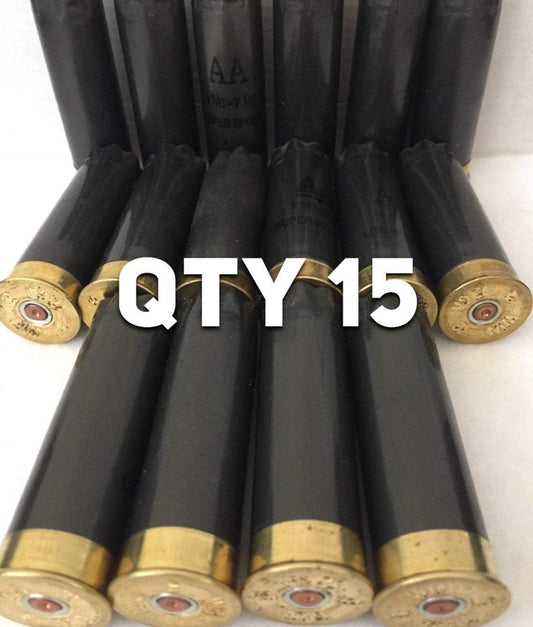 Fifteen dark gray Winchester AA shotgun shells lying flat with brass bases, featuring a large white QTY 15 text overlay.
