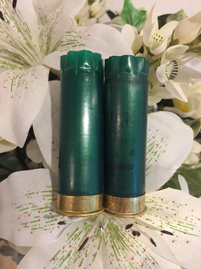 Two Dark Green Shotgun Hulls Styled With Artificial Flowers