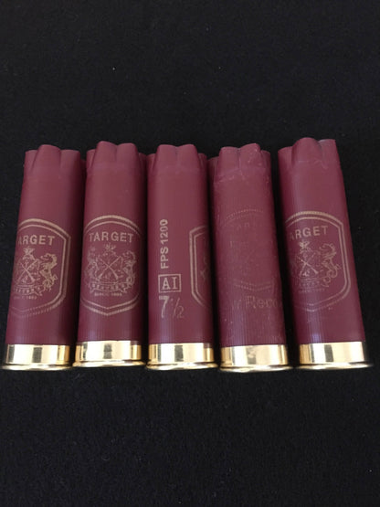 Five burgundy Herter’s Target 12 gauge shotgun shells standing upright on a black background, showing gold star-crimped tops and printed Target crest markings