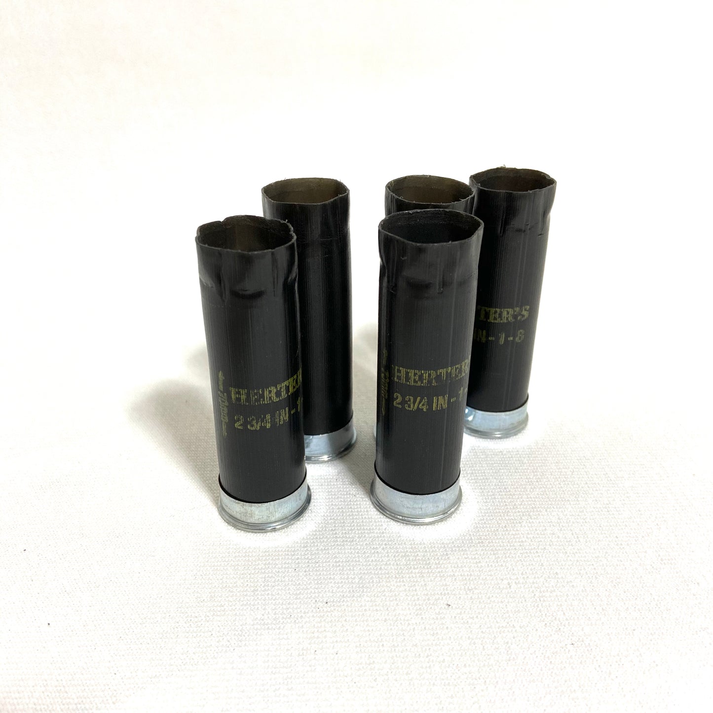 Inert, fired 12-gauge black shotgun shells by Herter's used for jewelry making and custom keychains.