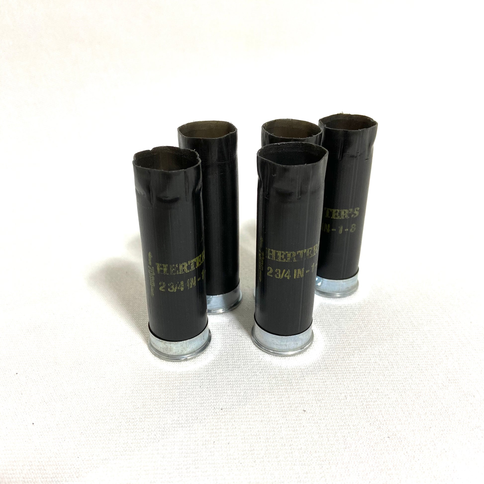 Inert, fired 12-gauge black shotgun shells by Herter's used for jewelry making and custom keychains.