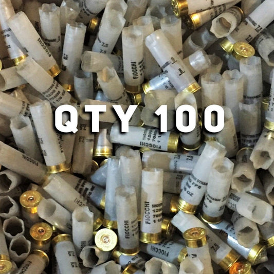 Pile of empty translucent Fiocchi 12ga hulls with brass bases and stamped markings