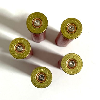 Five Fiocchi 28 gauge shotgun shell headstamps showing brass primers and FIOCCHI FC markings
