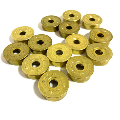 Gold Fiocchi 12 gauge deprimed shell bottoms grouped closely together, showing stamped Italy markings.