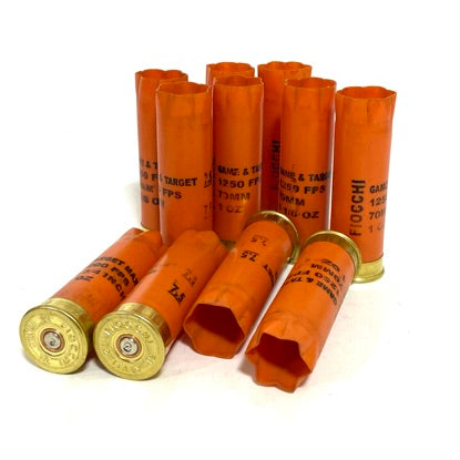 Ten orange Fiocchi 12 gauge hulls grouped together, showing gold bases and printed shell markings.