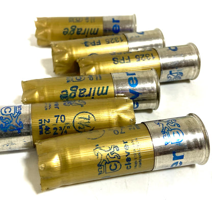 5 gold shotgun shells with silver bases lying at angles printed "mirage", "Bol D'Or", "1325 FPS", "clever" text