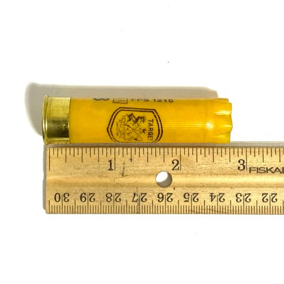 Close-up of yellow shotgun shells showing overlapping printed text and Target crest logo