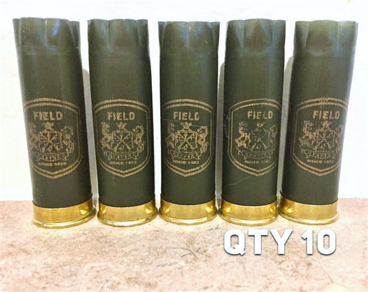 5 empty shotgun shells upright on countertop with overlay: QTY 10