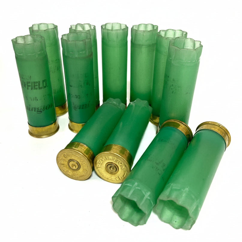 Light Green Remington Clay Field Hulls Standing With Headstamp Showing