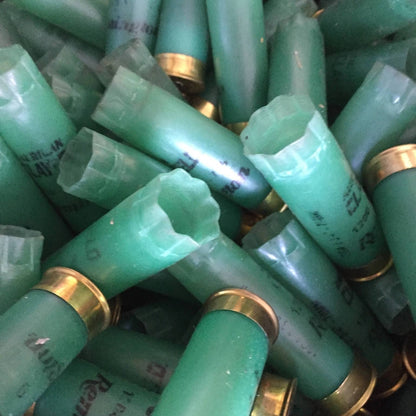 Pile Of Light Green Remington Clay Field 12 Gauge Hulls